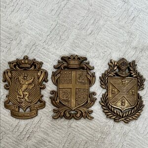 Set of 3 medieval coat of arms wall plaques by Burwood, vintage 1970's decor